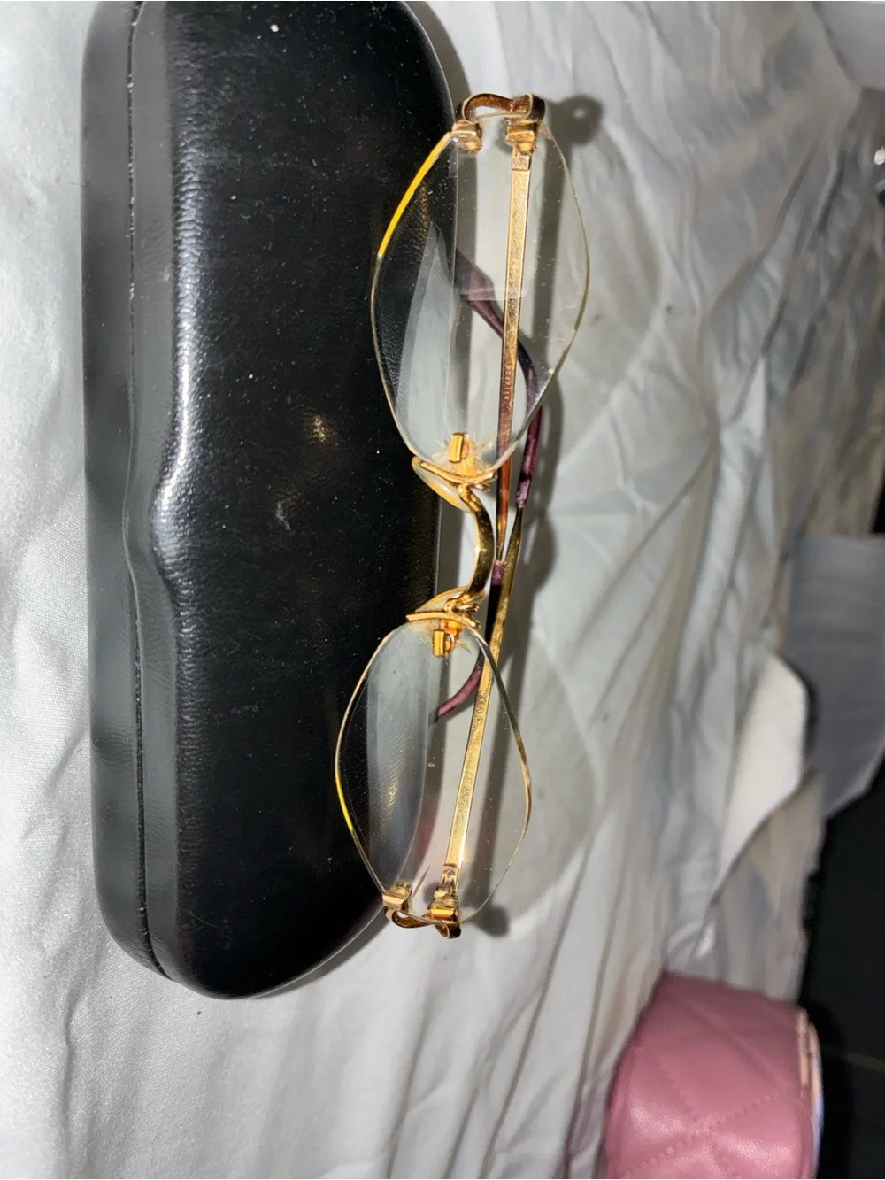 Cartier Gold Rimless Women's Glasses with Subtle Pink Temples